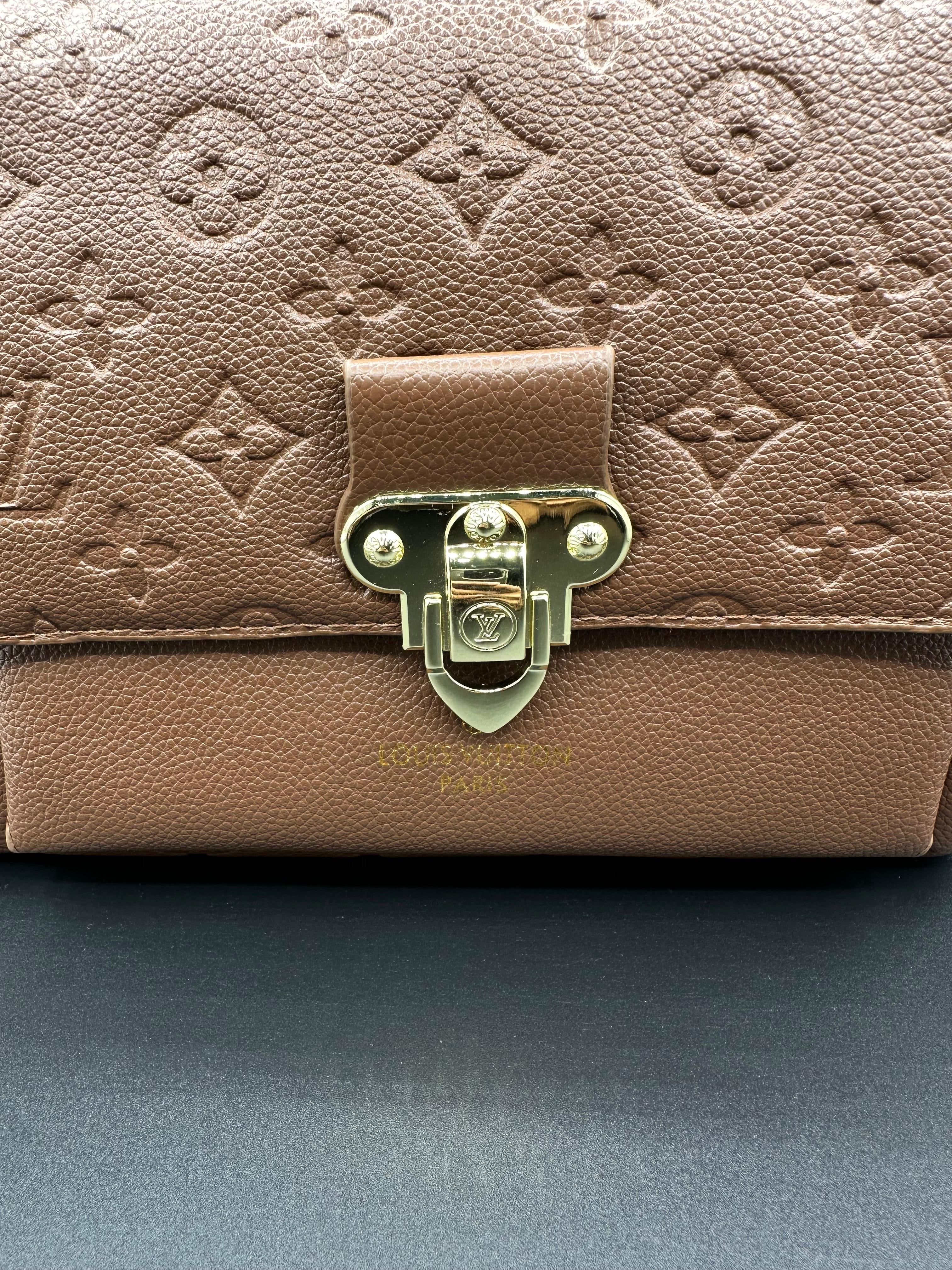 authentic lv vavin chain bag featuring iconic front flap and gold clasp