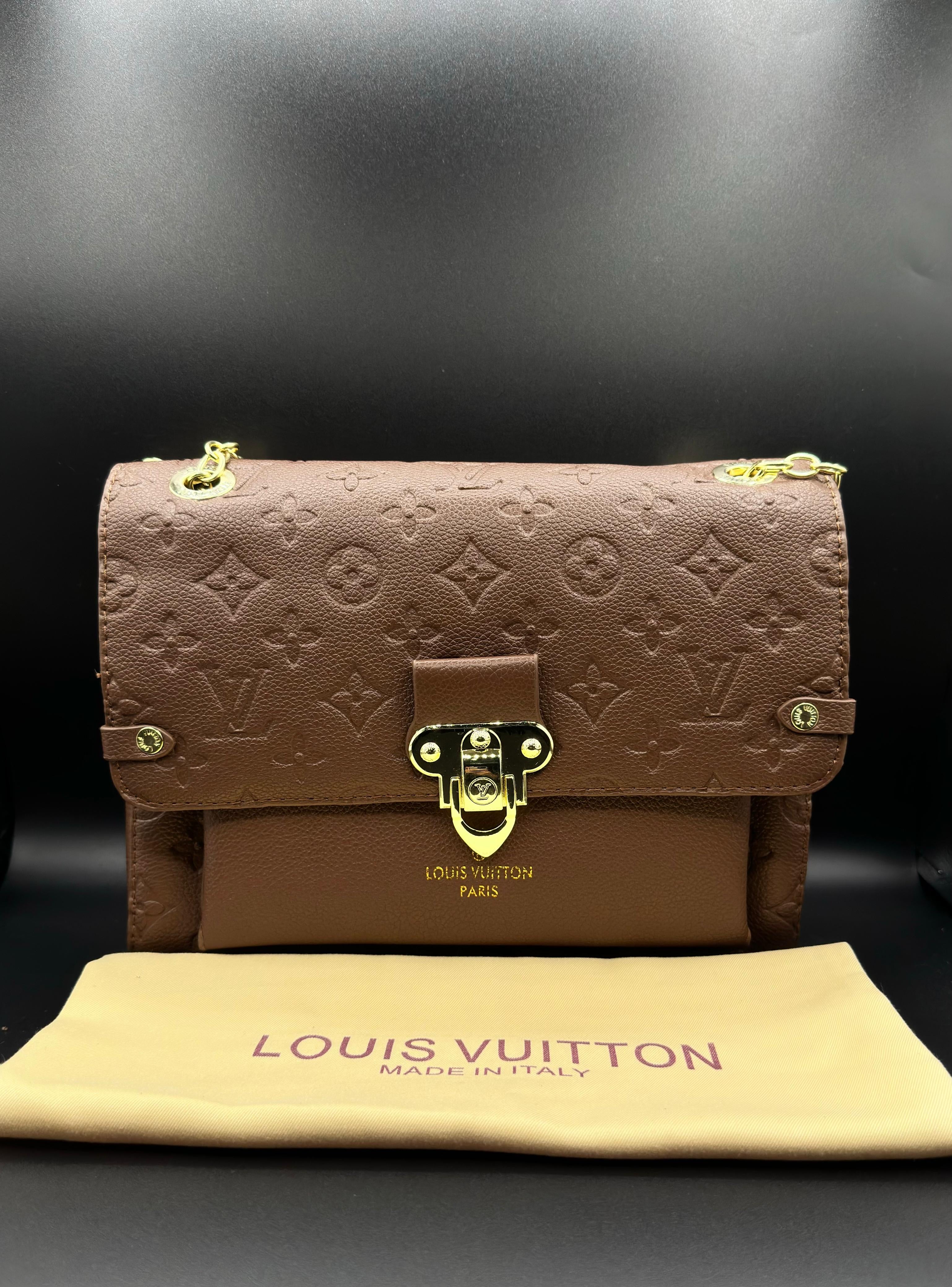 authentic lv vavin chain bag featuring iconic front flap and gold clasp