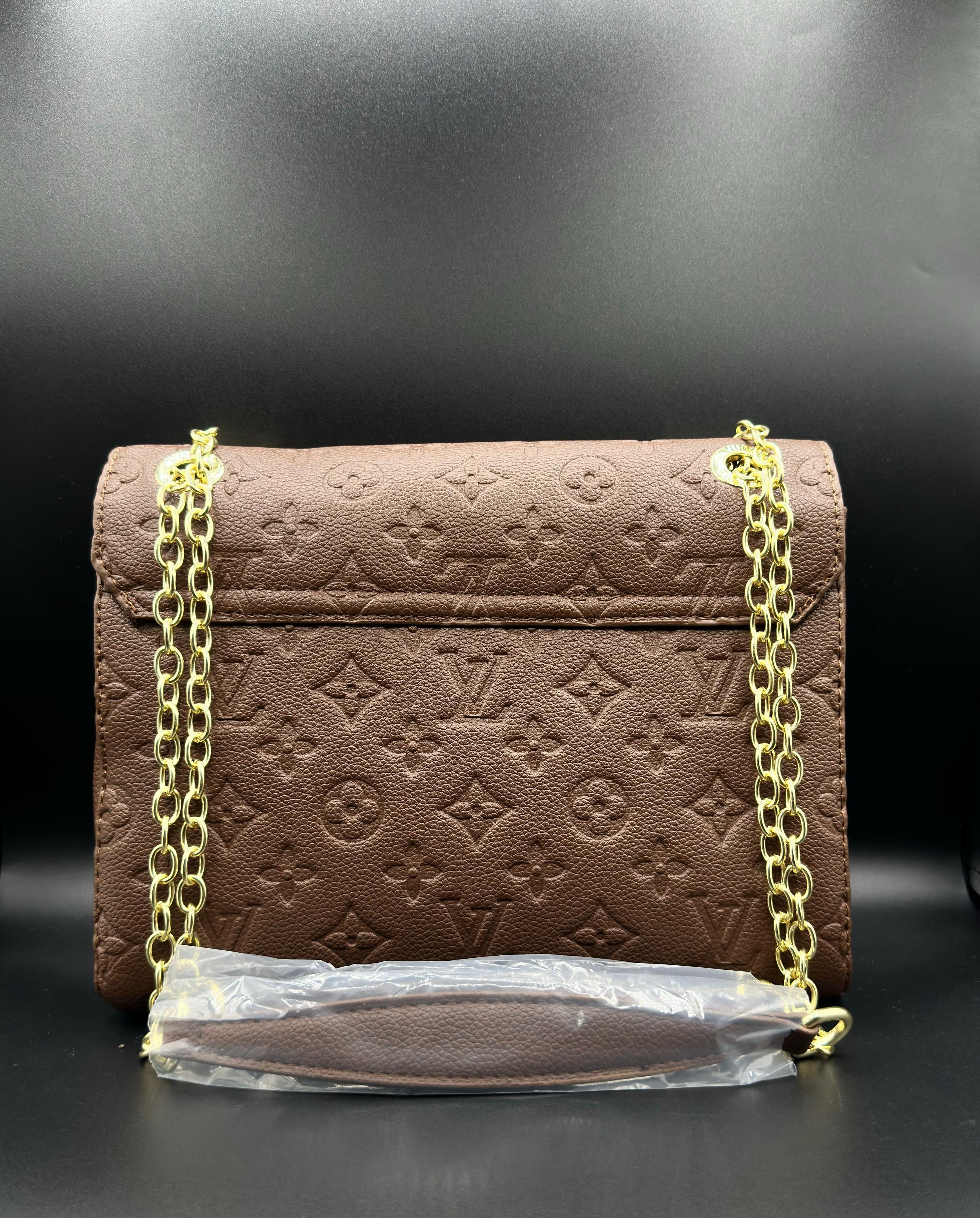 authentic lv vavin chain bag featuring iconic front flap and gold clasp