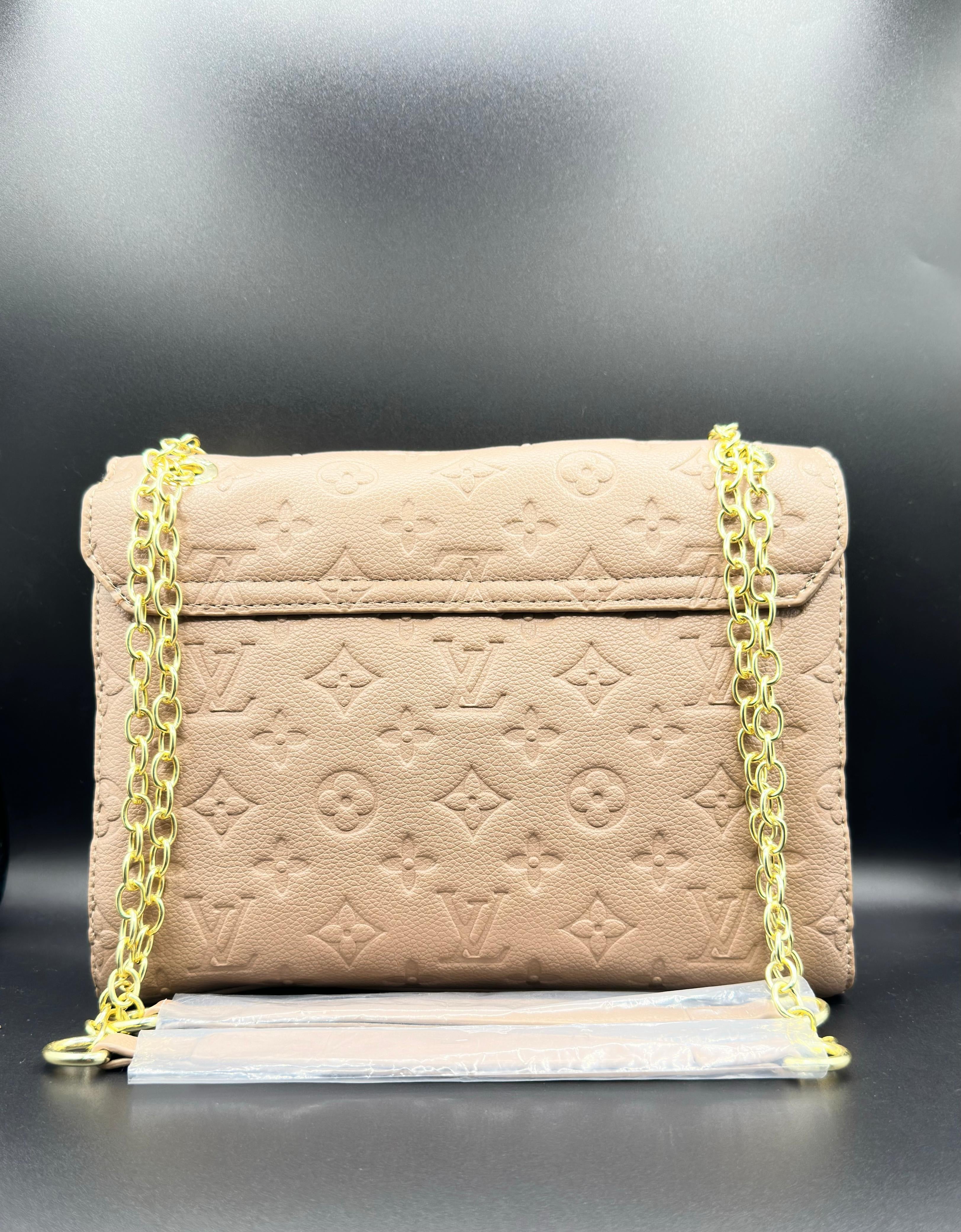 d0b54007-58e6-4876-a111-0ba97cb51955_355d53b2-52bf-430d-ae0a-c045d5a0dac0 Louis Vuitton Vavin PM Tobacco Tan Empreinte Leather Shoulder Bag - Image 2